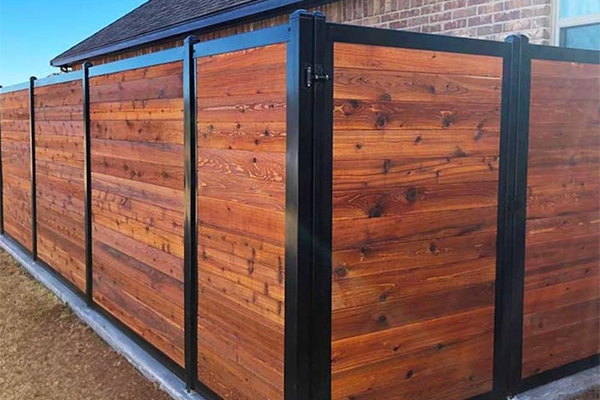 wood fence with black metal frame